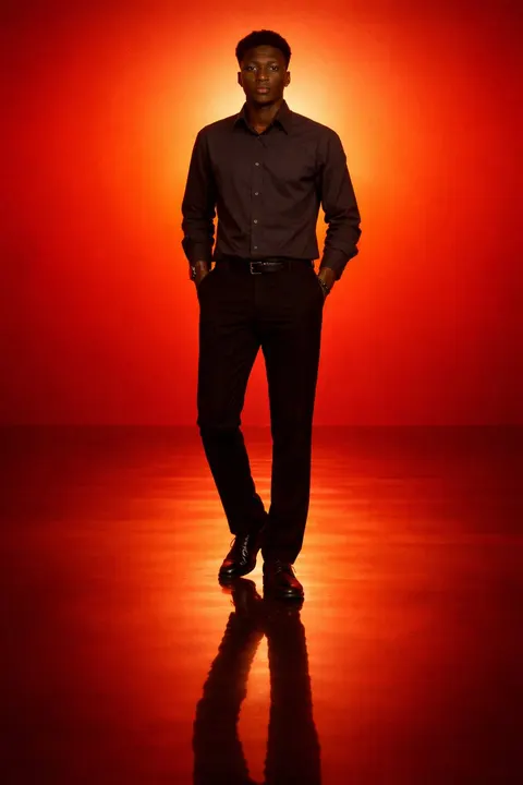 Solitary silhouette in an orange gradient — example composition